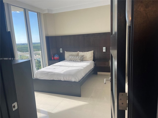 tiled bedroom featuring black refrigerator