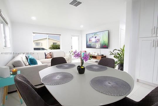 dining room with light tile patterned flooring