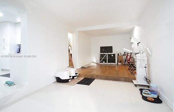 workout area featuring tile patterned floors