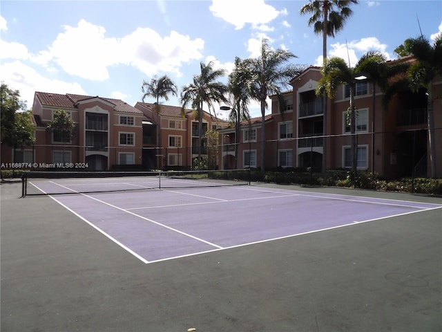 view of sport court featuring basketball hoop