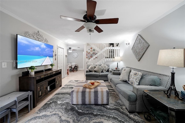 living room featuring ornamental molding, hardwood / wood-style floors, and ceiling fan