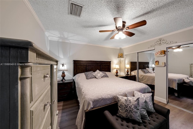 bedroom featuring ceiling fan, dark hardwood / wood-style flooring, and ornamental molding