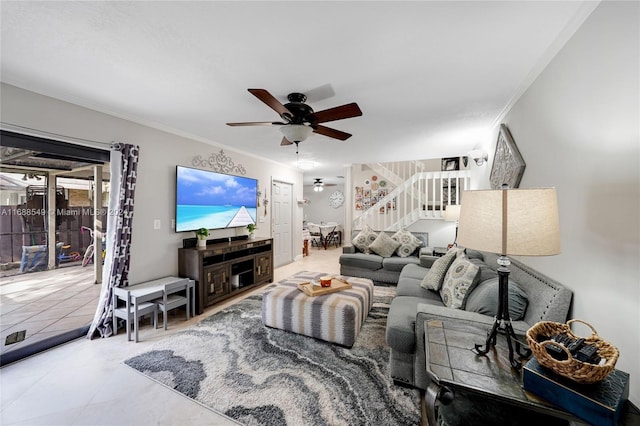 living room with ceiling fan and crown molding