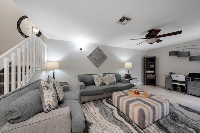 carpeted living room featuring ceiling fan