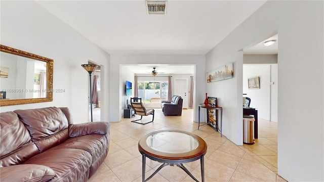 tiled living room featuring ceiling fan