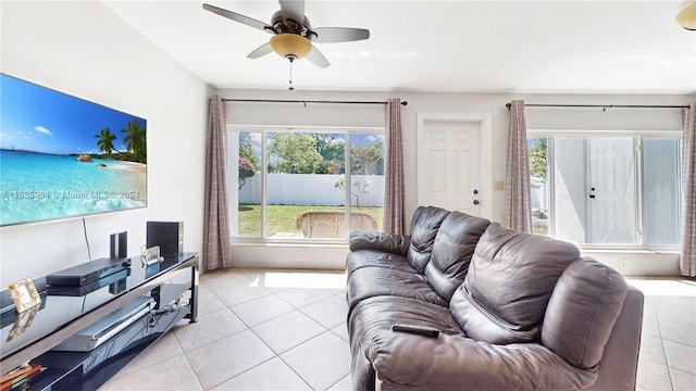 tiled living room with ceiling fan