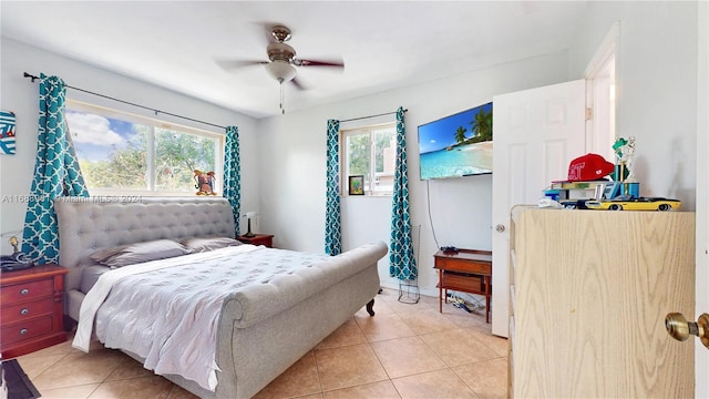 tiled bedroom with ceiling fan