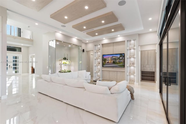 living room featuring a raised ceiling