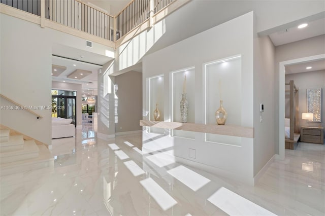 entrance foyer featuring french doors and a high ceiling