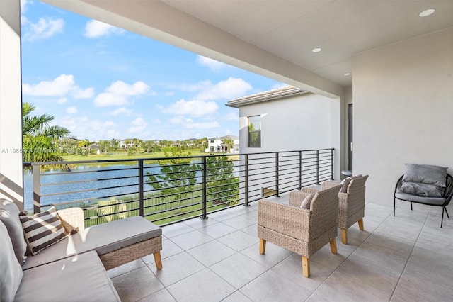 balcony featuring a water view