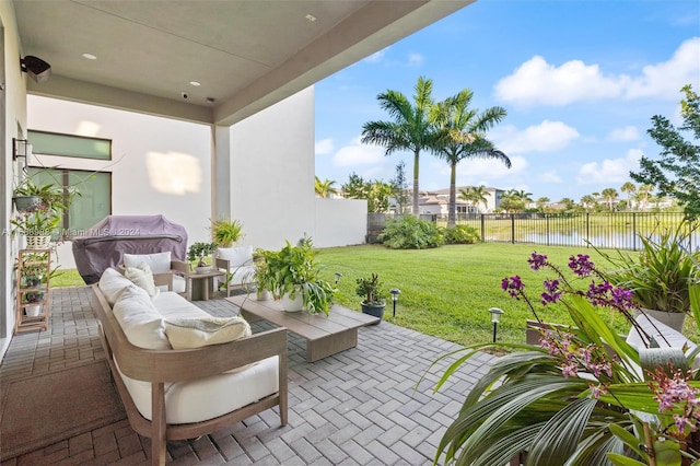 view of patio featuring a water view and an outdoor hangout area