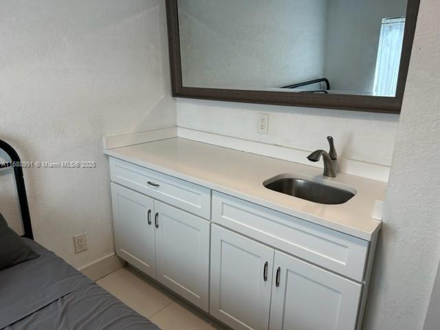 bathroom with tile patterned flooring and toilet