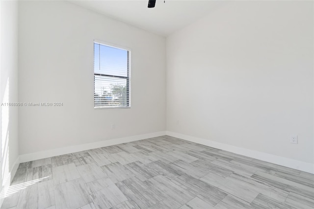 unfurnished room with ceiling fan