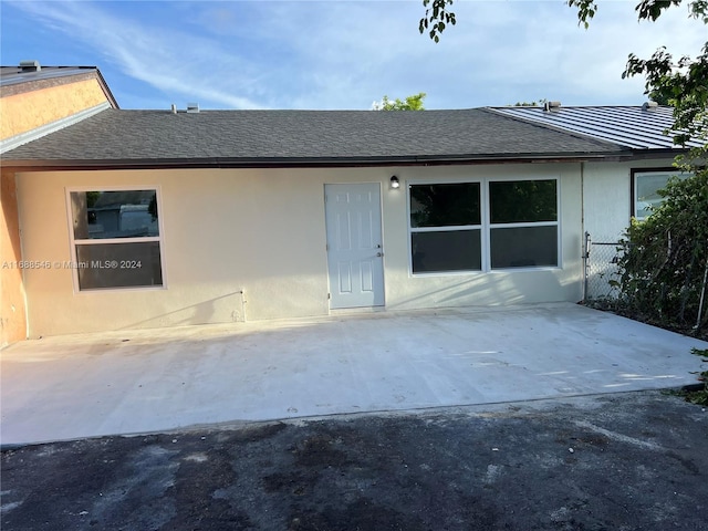 rear view of property with a patio area