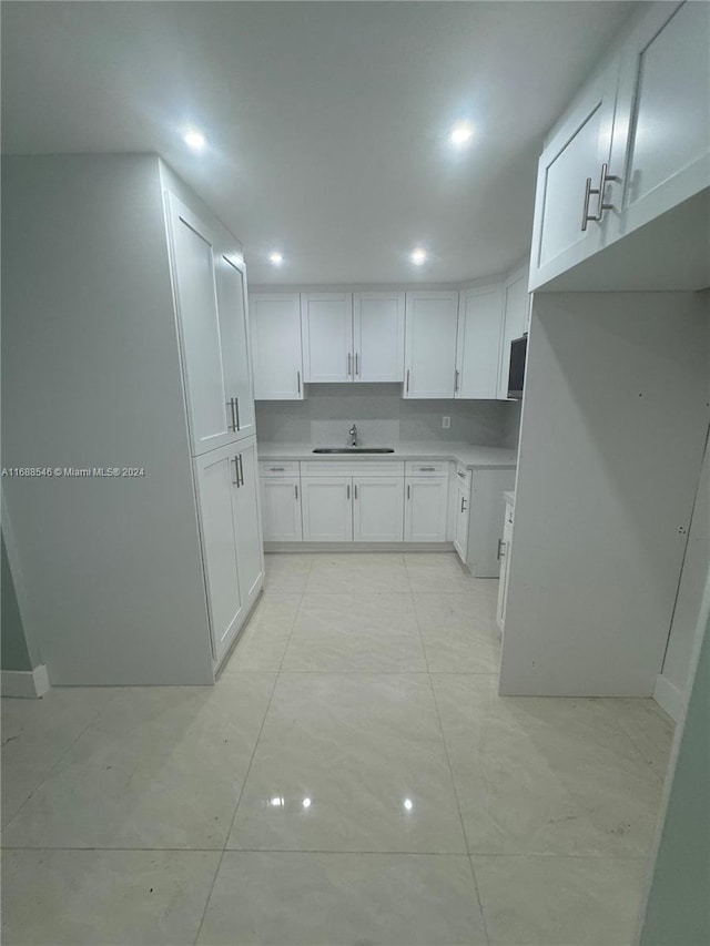 kitchen with white cabinets and sink