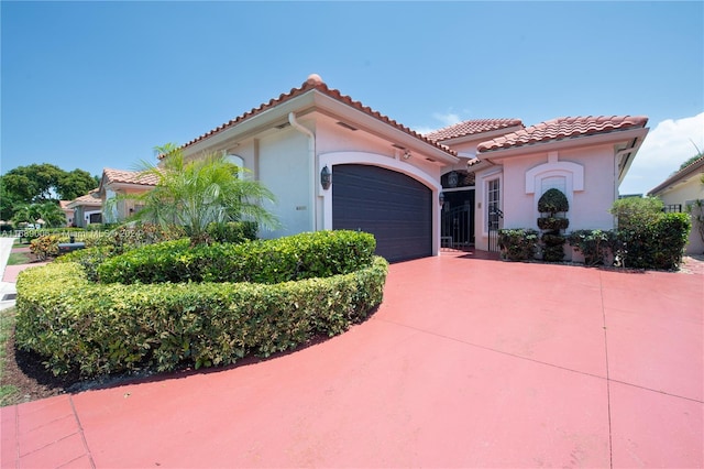 mediterranean / spanish-style house featuring a garage