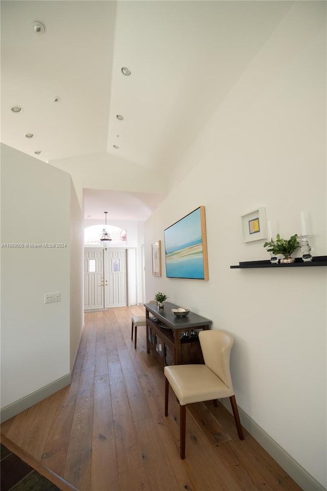 hall with hardwood / wood-style floors