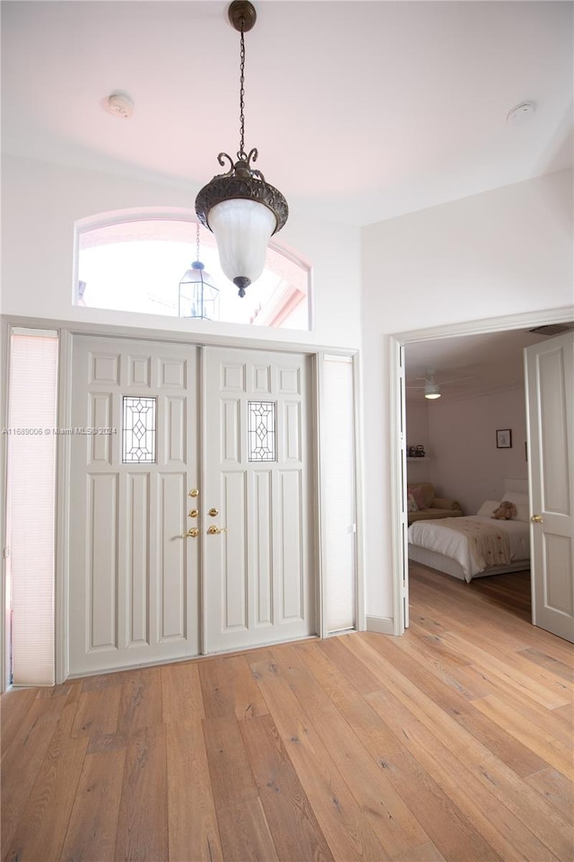 entryway with light hardwood / wood-style flooring