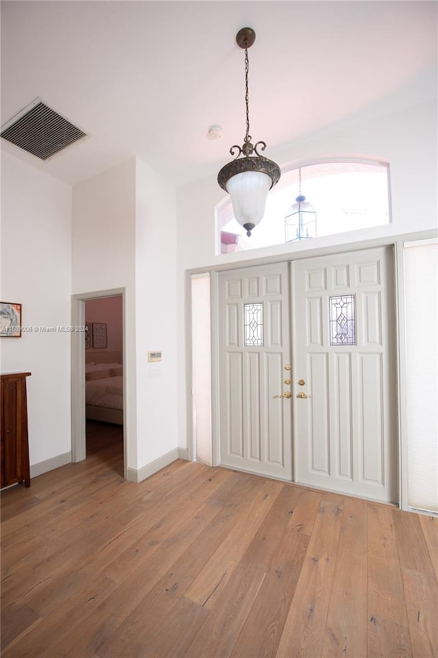 foyer entrance with hardwood / wood-style floors