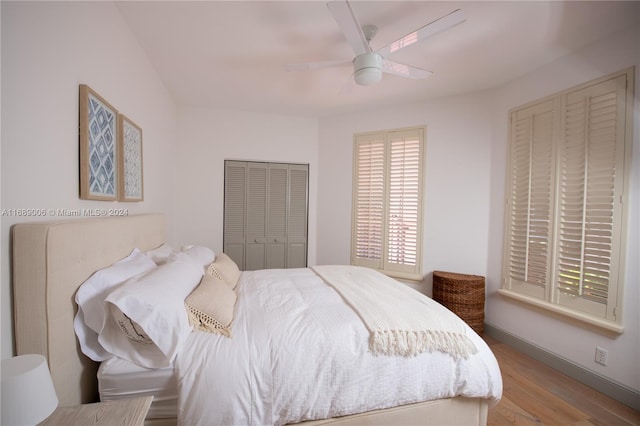 bedroom featuring light hardwood / wood-style floors and ceiling fan