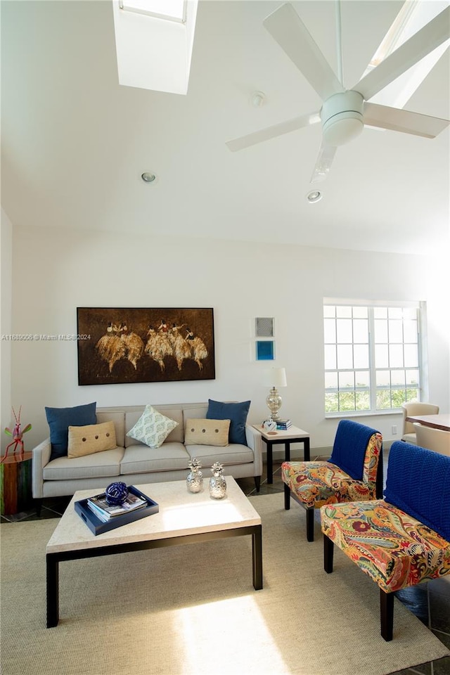 living room with ceiling fan and carpet flooring