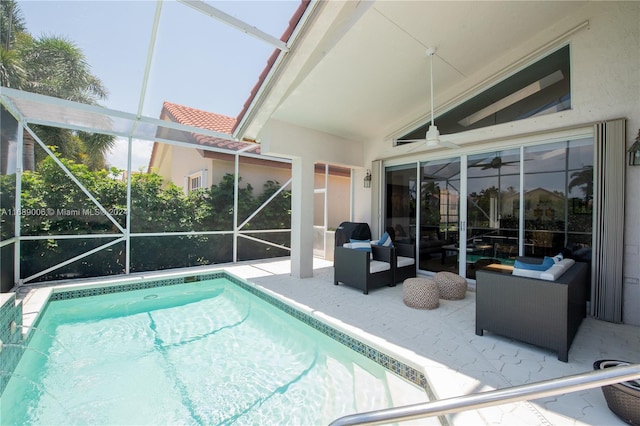 view of swimming pool with glass enclosure, outdoor lounge area, a patio, and ceiling fan