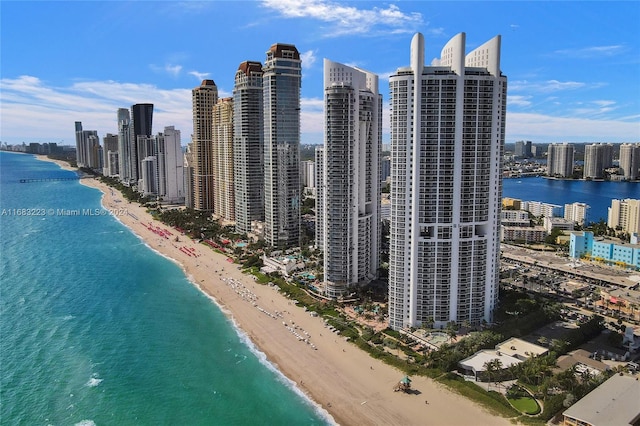 drone / aerial view featuring a view of the beach and a water view