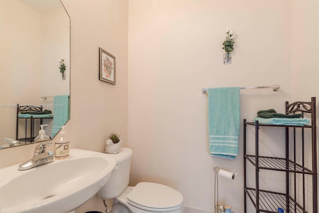 bathroom with toilet and sink