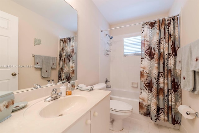 full bathroom featuring toilet, vanity, tile patterned floors, and shower / tub combo