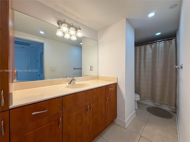 bathroom with tile patterned floors, toilet, and vanity