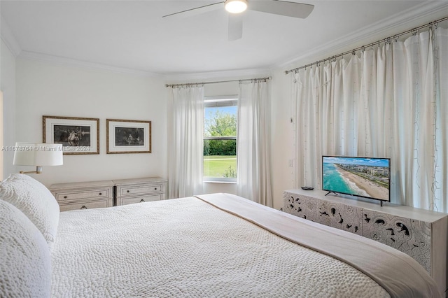 bedroom featuring ceiling fan and crown molding