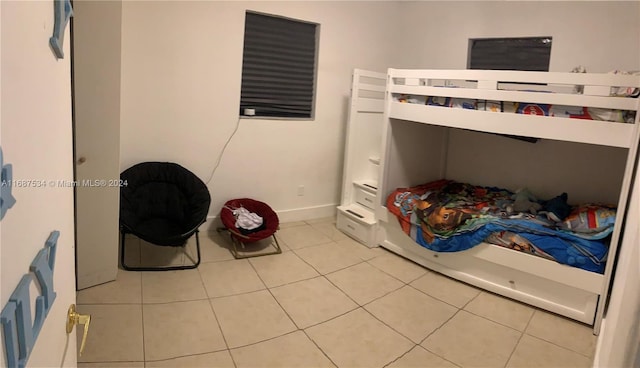 bedroom featuring light tile patterned floors