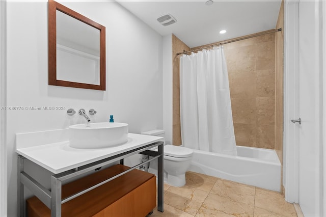 full bathroom with vanity, toilet, and shower / bath combination with curtain