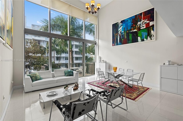 tiled living room featuring a high ceiling and a chandelier