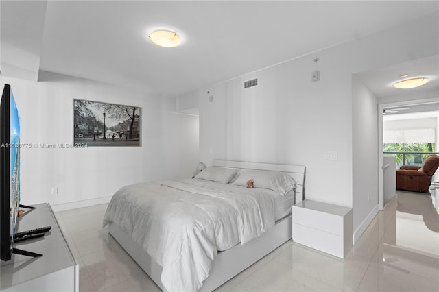 bedroom featuring light tile patterned floors