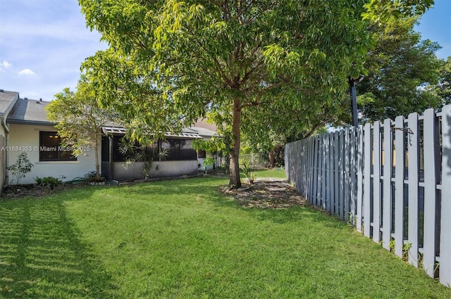 view of yard with a fenced backyard