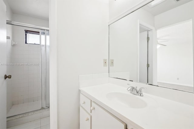 full bathroom featuring vanity and a stall shower