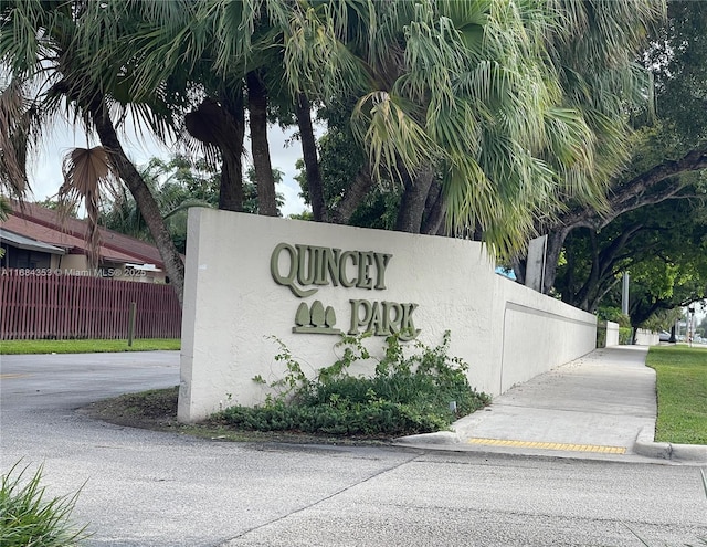 community sign with fence