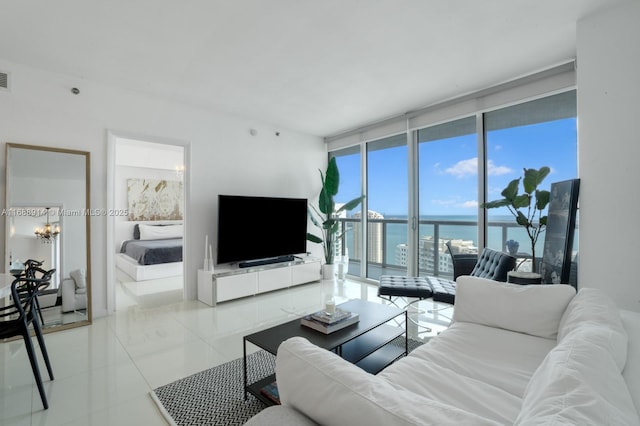 tiled living room with expansive windows and a wealth of natural light