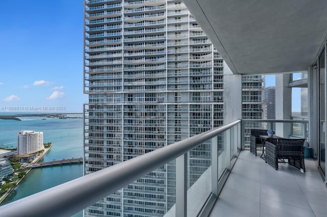 balcony featuring a water view