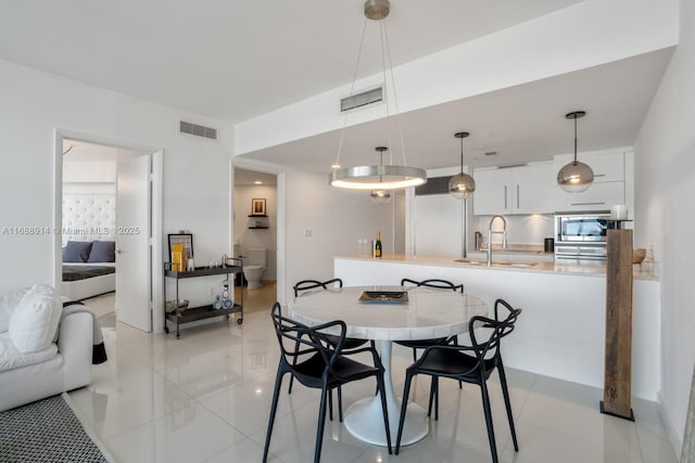 tiled dining area with sink