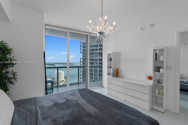 tiled bedroom featuring expansive windows, a water view, and access to outside