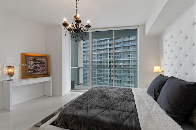 bedroom featuring an inviting chandelier and floor to ceiling windows