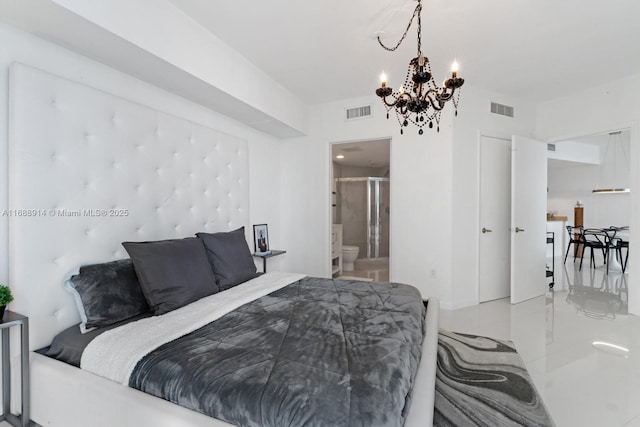 bedroom with a notable chandelier and ensuite bath