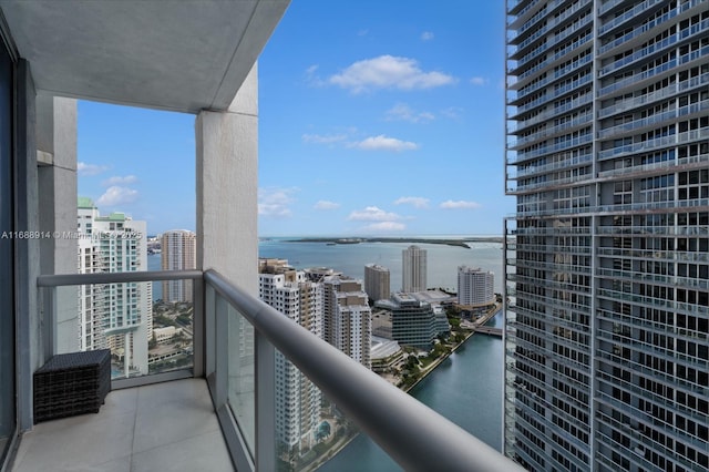 balcony featuring a water view