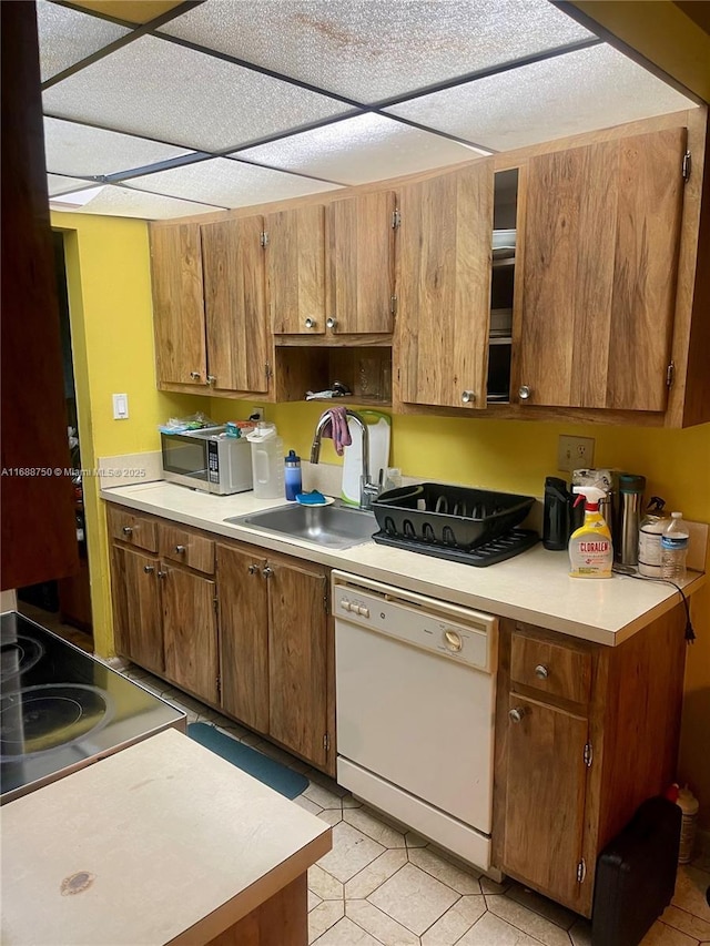 kitchen with white dishwasher and sink