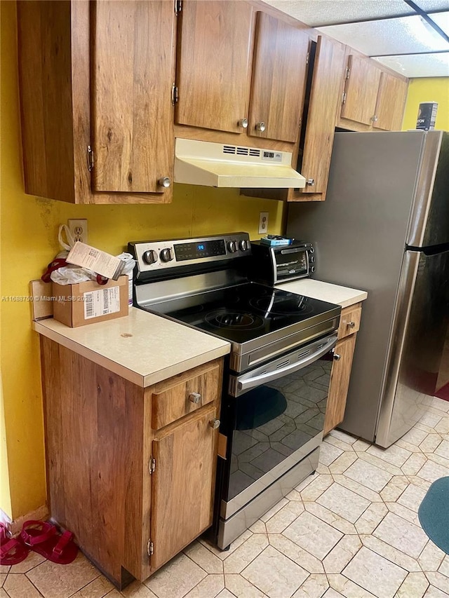 kitchen with range hood and appliances with stainless steel finishes