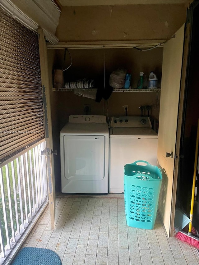 clothes washing area with washer and dryer