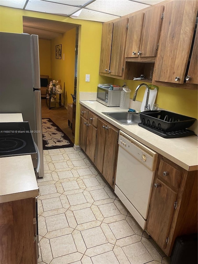 kitchen featuring sink and white appliances