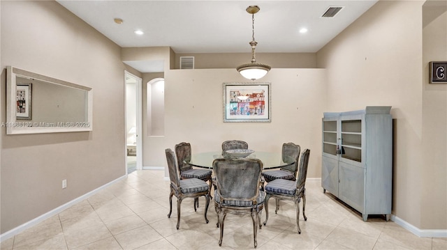 dining space featuring light tile patterned floors